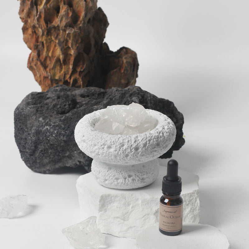 minimalist white stone diffuser with essential oil bottle