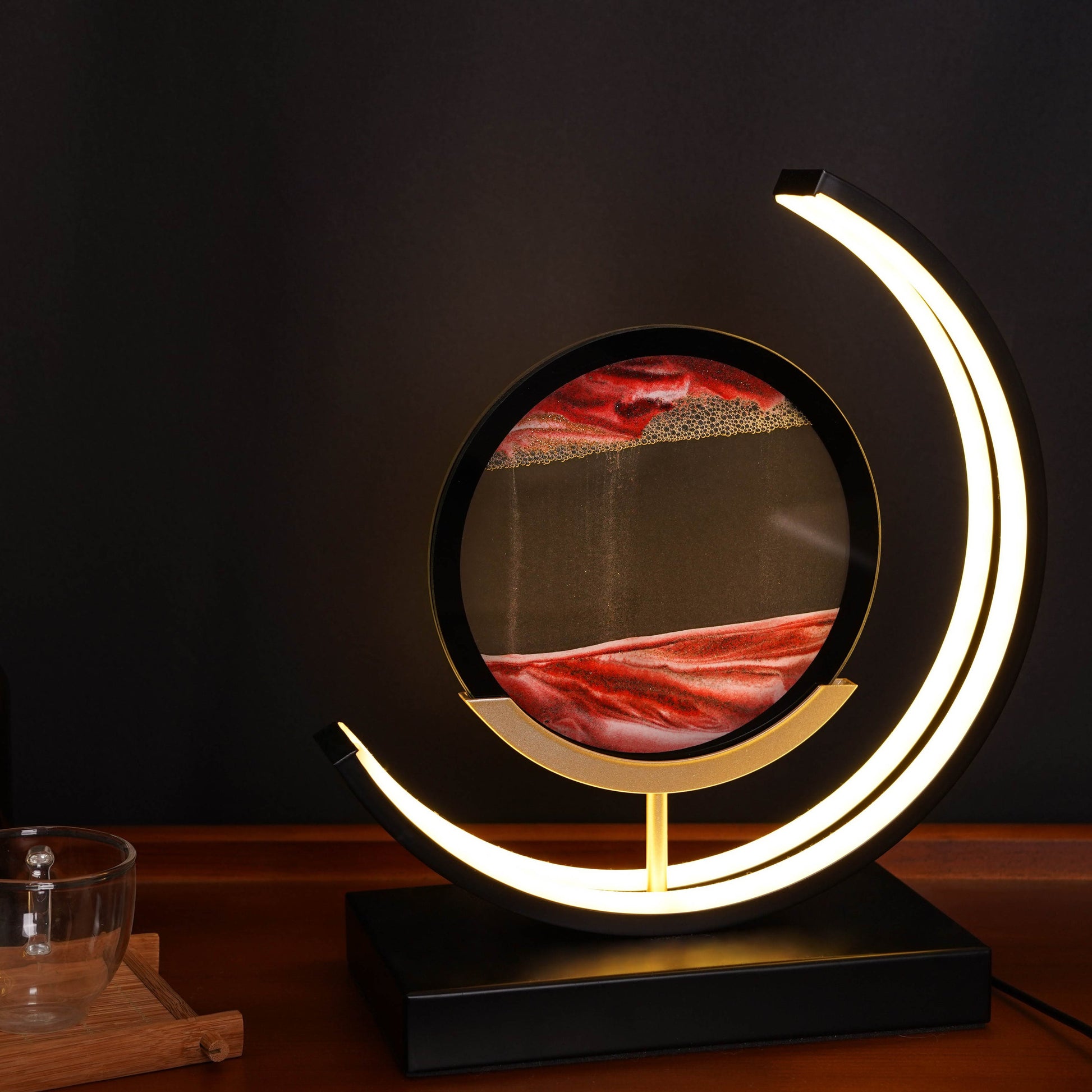 Moving sand art lamp in dark ambient setting